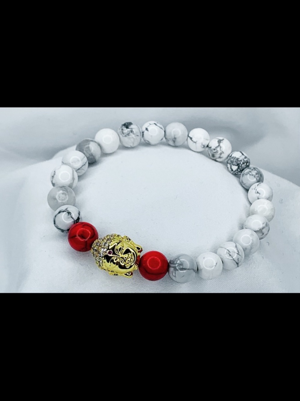 White Marbled Bead Bracelet with Red Accents and Gold Charm